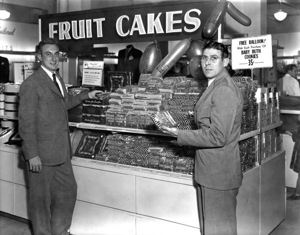 grocery store display of fruitcakes